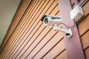 security camera on wooden wall
