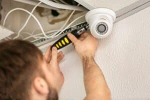 person installing security cameras Benalla